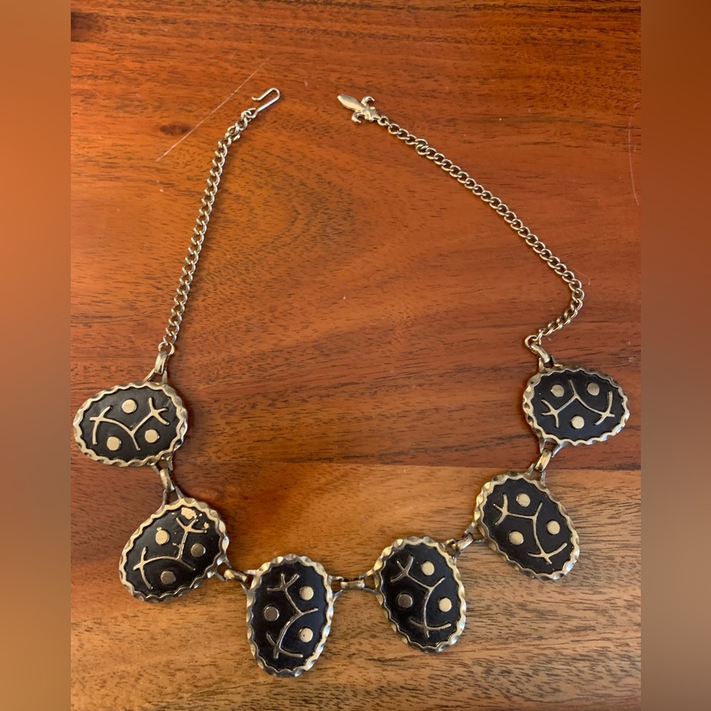Is it Damascene is it Mod? very cool gold tone, and raised black symbols.